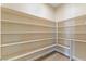 Walk-in pantry with custom shelving provides ample storage space at 12168 Dorada Coast Ave, Las Vegas, NV 89138