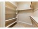 Walk-in closet with built in shelving and hanging rods, offering ample storage space at 12168 Dorada Coast Ave, Las Vegas, NV 89138