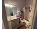 Bathroom with a single sink vanity, toilet, and a shower-tub combination at 1409 Velvet Leaf Dr, North Las Vegas, NV 89032