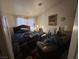 Bedroom showcasing natural light, a bed, and a cozy seating area at 1409 Velvet Leaf Dr, North Las Vegas, NV 89032