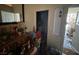 View of the entryway with a desk, mirror, and doorway to the outside at 1409 Velvet Leaf Dr, North Las Vegas, NV 89032