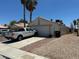 Single story home on a street with a driveway and low maintenance front yard and back yard at 1409 Velvet Leaf Dr, North Las Vegas, NV 89032