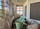 Enclosed patio with furniture, window with bars, and wall screens at 1409 Velvet Leaf Dr, North Las Vegas, NV 89032