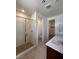 Bathroom featuring double sinks, walk in shower and linen closet at 1467 Melodic Lark Ln, Las Vegas, NV 89138