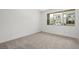 Bright unfurnished bedroom with carpet and large windows to the neighborhood at 1467 Melodic Lark Ln, Las Vegas, NV 89138