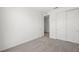 Bright bedroom with carpet, closet with doors, and an open door at 1467 Melodic Lark Ln, Las Vegas, NV 89138