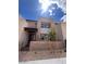 Modern two-story townhome with desert landscaping and architectural details at 1467 Melodic Lark Ln, Las Vegas, NV 89138