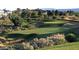 Lush green golf course view within the community, surrounded by mature trees and landscaping at 1467 Melodic Lark Ln, Las Vegas, NV 89138