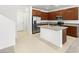 Bright kitchen featuring stainless steel appliances, granite counters, and a central island at 1467 Melodic Lark Ln, Las Vegas, NV 89138