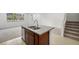 Stylish kitchen island with granite countertop and stainless sink near the staircase at 1467 Melodic Lark Ln, Las Vegas, NV 89138