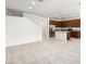 Open-concept living area flowing into a kitchen with stainless steel appliances and a center island at 1467 Melodic Lark Ln, Las Vegas, NV 89138