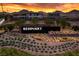 Landscaped entrance to Redpoint community with prominent sign against a mountain backdrop at sunset at 1467 Melodic Lark Ln, Las Vegas, NV 89138