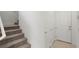 Carpeted stairs lead upwards in a well lit space next to storage closets at 1467 Melodic Lark Ln, Las Vegas, NV 89138