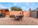 Outdoor dining area with a table and chairs, a grill, and a convenient shed for storage at 147 Cervantes St, Las Vegas, NV 89101