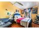 Bright bedroom with wood floors, a queen bed, unique decor, and natural light at 147 Cervantes St, Las Vegas, NV 89101