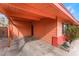 View of the property's covered carport and side yard with minimal landscaping at 147 Cervantes St, Las Vegas, NV 89101
