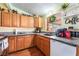 Updated kitchen with wood cabinets, granite countertops, and modern appliances at 147 Cervantes St, Las Vegas, NV 89101