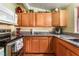 Charming kitchen featuring wood cabinets and granite countertops at 147 Cervantes St, Las Vegas, NV 89101