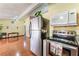 Bright kitchen area with hardwood floors and stainless steel appliances at 147 Cervantes St, Las Vegas, NV 89101