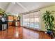 Bright open concept living area with hardwood floors connecting the kitchen at 147 Cervantes St, Las Vegas, NV 89101