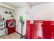 Functional laundry room with a washer, dryer, and shelving for storage at 147 Cervantes St, Las Vegas, NV 89101