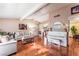 Bright living room with wood floors and a piano next to the seating area at 147 Cervantes St, Las Vegas, NV 89101
