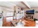 Cozy living room featuring hardwood floors, a white piano, and stylish decor at 147 Cervantes St, Las Vegas, NV 89101