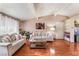 Cozy living room featuring wood floors and comfortable seating arrangements at 147 Cervantes St, Las Vegas, NV 89101