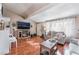 Inviting living room featuring warm wood floors and comfortable furnishings at 147 Cervantes St, Las Vegas, NV 89101