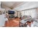 Bright living room with vaulted ceiling, hardwood floors, and a decorative fireplace at 147 Cervantes St, Las Vegas, NV 89101