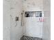 Shower stall featuring stylish marble tiling and a convenient built-in shelf for toiletries at 147 Cervantes St, Las Vegas, NV 89101