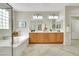Bathroom featuring a soaking tub and double vanity at 2244 Shadow Canyon Dr, Henderson, NV 89044