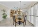 Well-lit dining area with tile flooring, and a view into the kitchen at 2244 Shadow Canyon Dr, Henderson, NV 89044