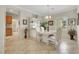 Comfortable dining area with tile flooring, a chandelier, and a view to the living spaces in the home at 2244 Shadow Canyon Dr, Henderson, NV 89044