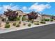 Charming single-story home with desert landscaping, mature trees and a welcoming front entrance at 2244 Shadow Canyon Dr, Henderson, NV 89044