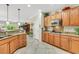 Corner view of bright eat-in kitchen featuring granite counters, stainless appliances, and wooden cabinets at 2244 Shadow Canyon Dr, Henderson, NV 89044