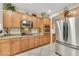 Charming kitchen features stainless appliances, granite countertops and wooden cabinets at 2244 Shadow Canyon Dr, Henderson, NV 89044