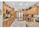 Spacious kitchen featuring granite countertops, stainless steel appliances, and wooden cabinets at 2244 Shadow Canyon Dr, Henderson, NV 89044