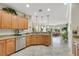 Bright eat-in kitchen features granite counters, stainless appliances, and wooden cabinets at 2244 Shadow Canyon Dr, Henderson, NV 89044