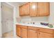 Functional laundry room features sink, lower cabinets, and ample storage at 2244 Shadow Canyon Dr, Henderson, NV 89044