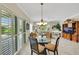 Open-concept living space with tile flooring, shutters, and a dining area at 2244 Shadow Canyon Dr, Henderson, NV 89044
