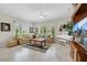 Bright living room with shutters, tile flooring, and an open layout at 2244 Shadow Canyon Dr, Henderson, NV 89044