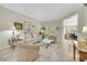 Bright living room features a neutral palette, tile flooring, and elegant decor at 2244 Shadow Canyon Dr, Henderson, NV 89044