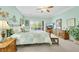 Comfortable main bedroom features serene décor and slider access to outdoor patio at 2244 Shadow Canyon Dr, Henderson, NV 89044