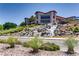 Stunning water feature cascading down a landscaped hill, showcasing the community's beauty at 2244 Shadow Canyon Dr, Henderson, NV 89044