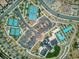 Aerial view of community amenities, including tennis courts, swimming pool, and ample parking at 25 Red Creek Bluff St, Henderson, NV 89011