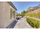 Spacious backyard patio features dining and lounge seating areas perfect for relaxing or entertaining guests at 25 Red Creek Bluff St, Henderson, NV 89011