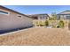 Cozy backyard featuring desert landscaping and a lounge chair, perfect for outdoor relaxation at 25 Red Creek Bluff St, Henderson, NV 89011