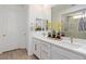 Bright bathroom with double sinks, modern fixtures, and a glass-enclosed shower at 25 Red Creek Bluff St, Henderson, NV 89011