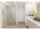 Modern bathroom with a glass-enclosed shower, double vanity, and sleek fixtures at 25 Red Creek Bluff St, Henderson, NV 89011